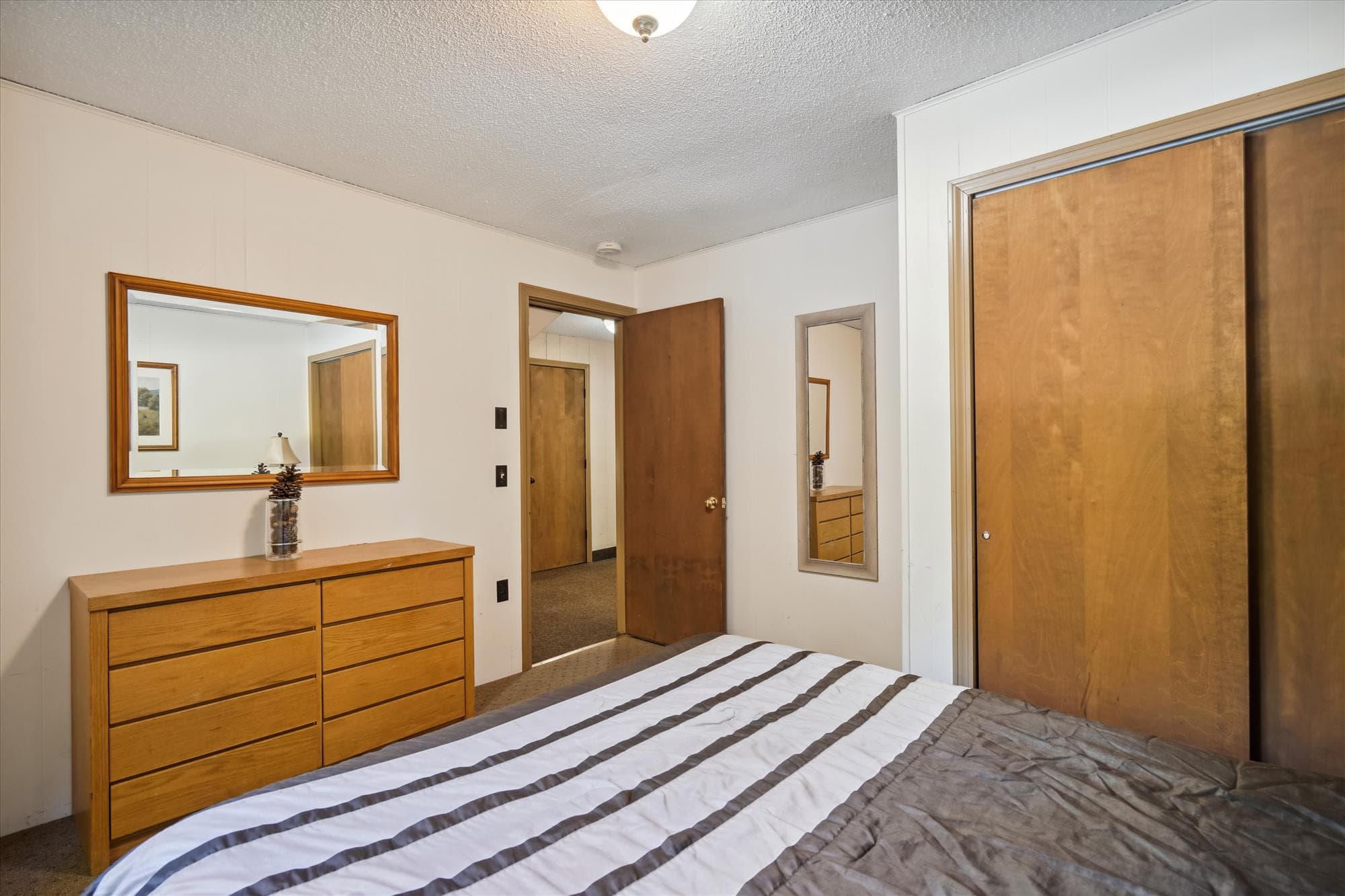 This bedroom has plenty of closet space.
