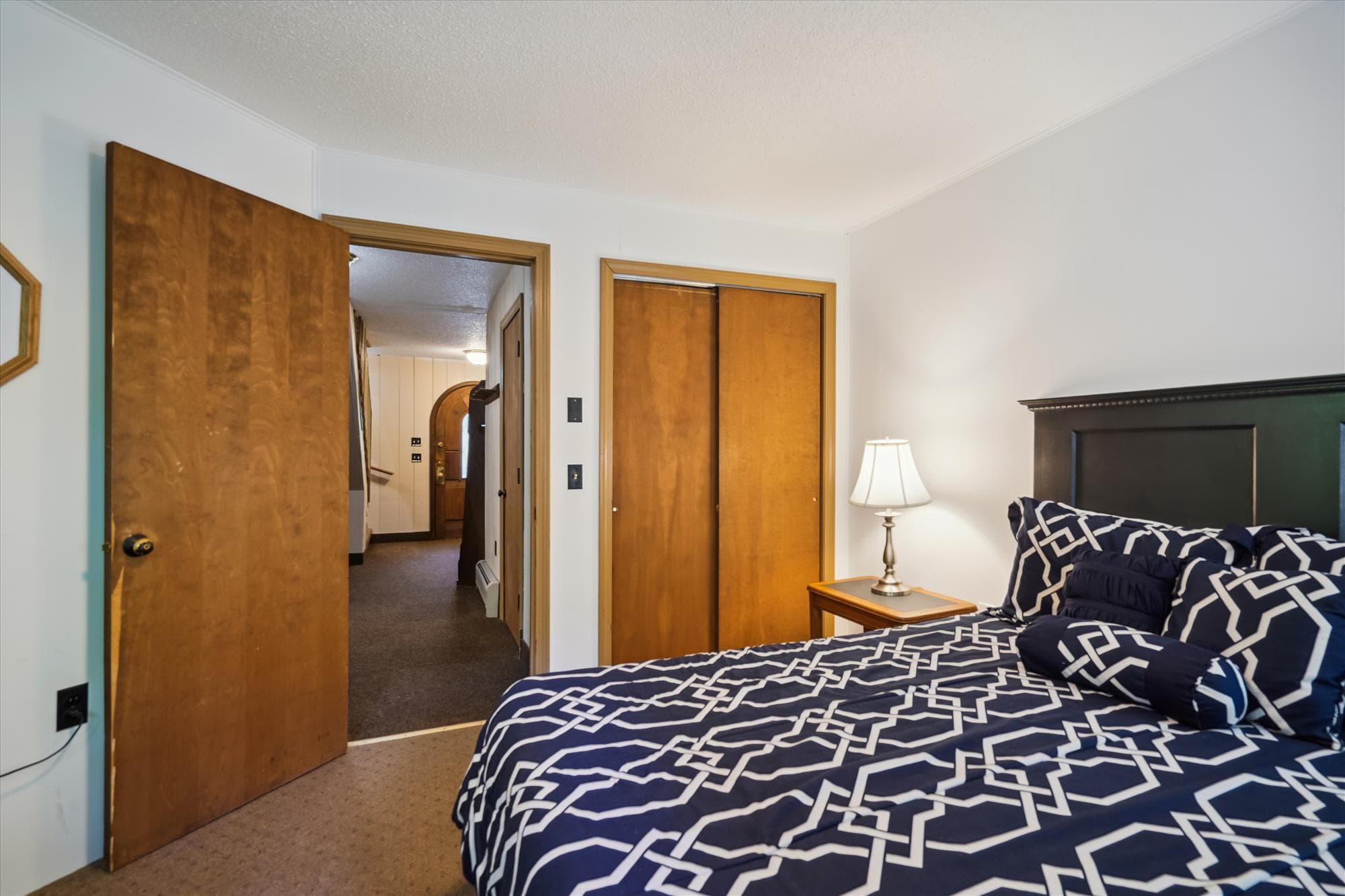 This bedroom offers a closet to put all of your clothes.