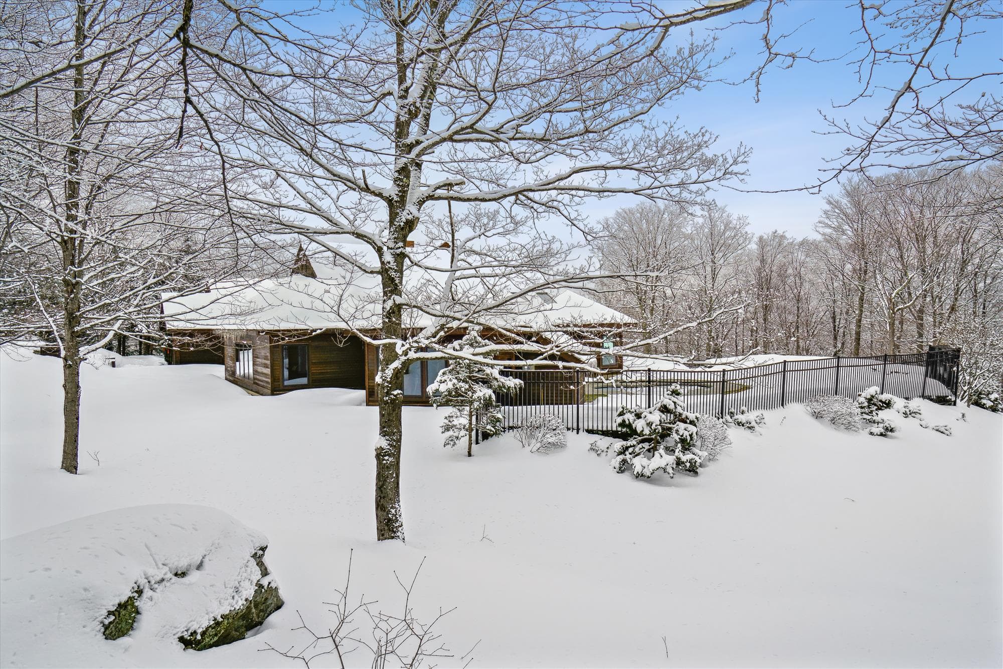 Peaceful wooded setting around the Highridge Sports Center with scenic winter views.