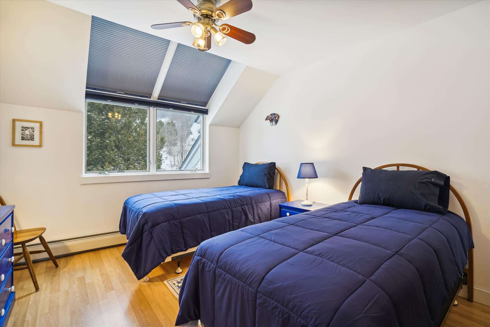 Upper level bedroom has twin beds.