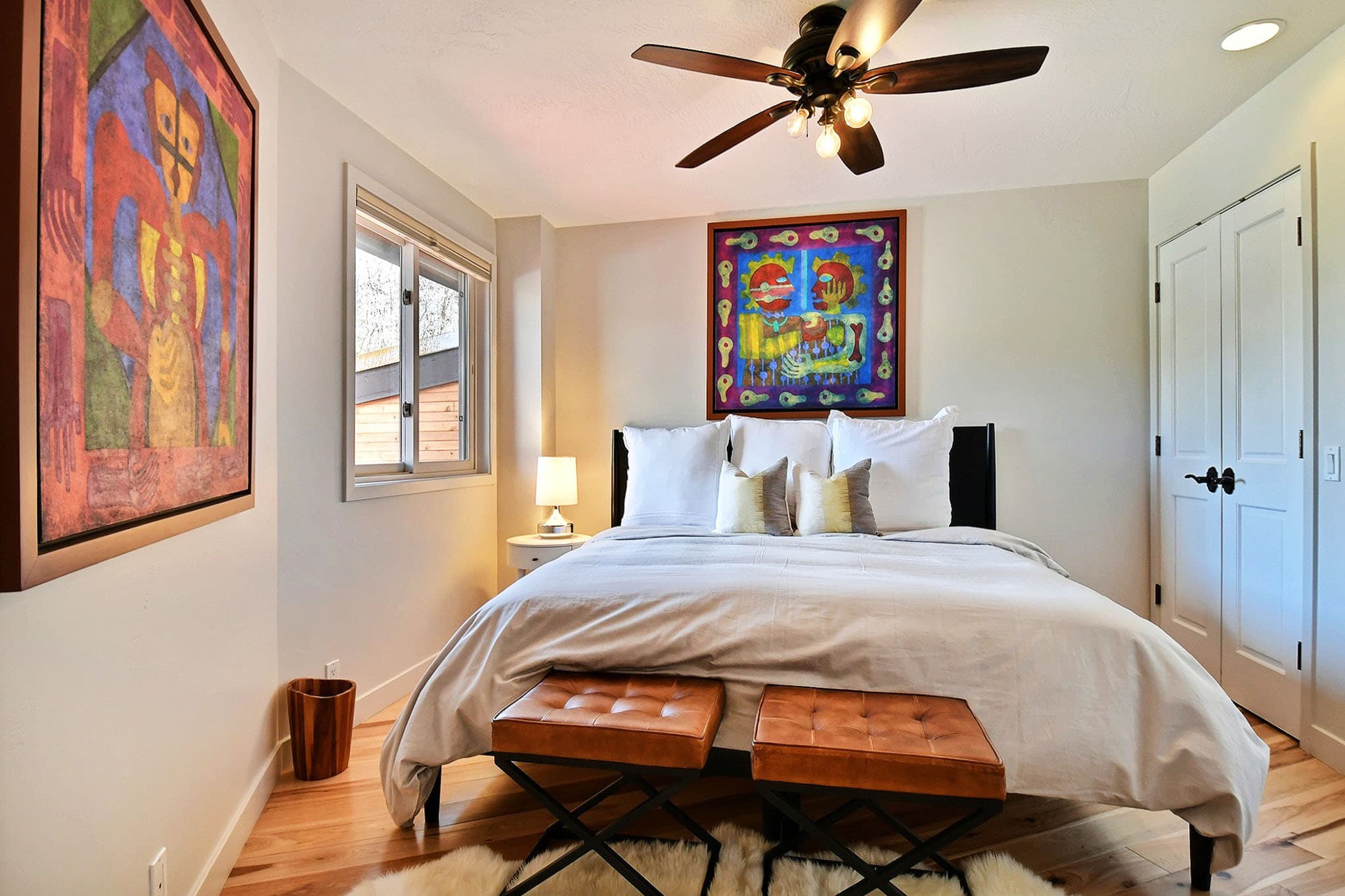 Bed, Two Chairs, Paintings, Ceiling Fan