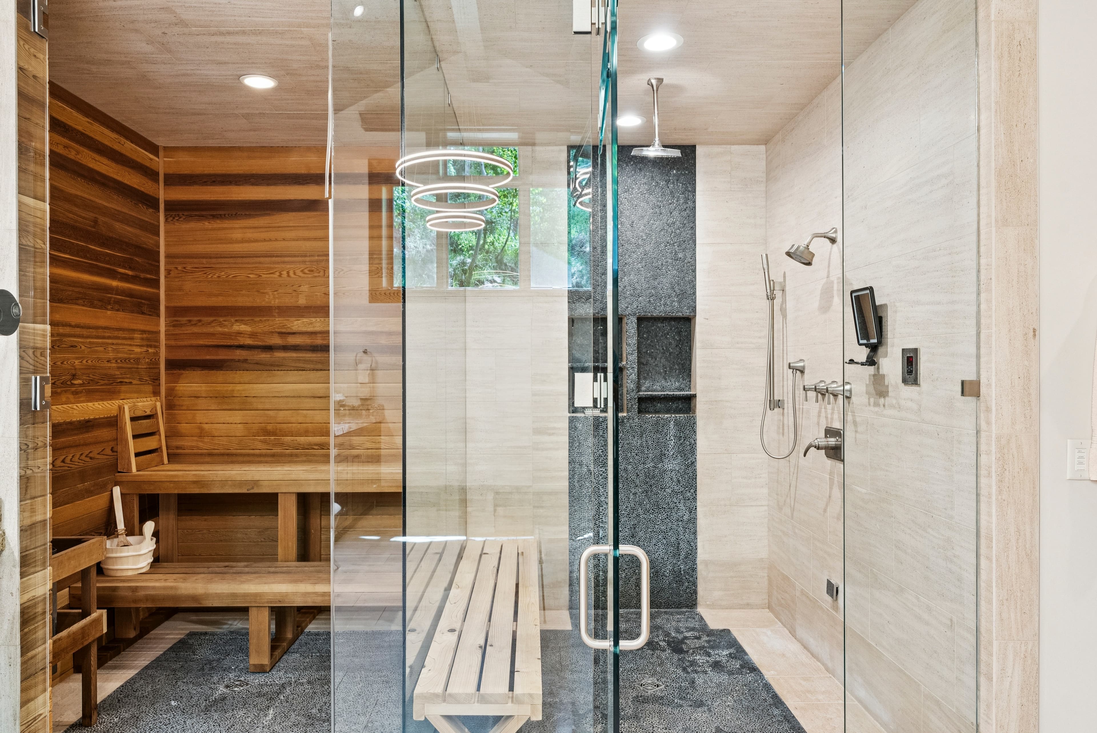 large walk in shower and steam shower in primary bathroom