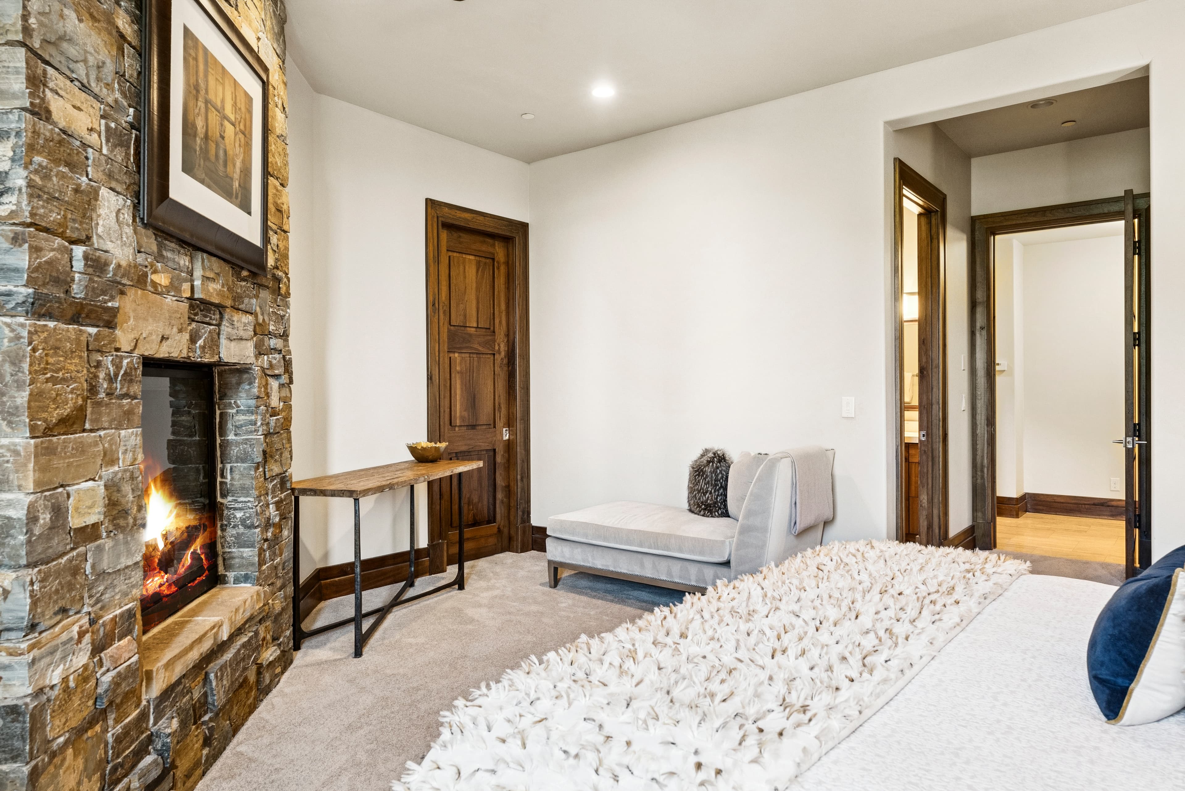 guest suite with stone fireplace
