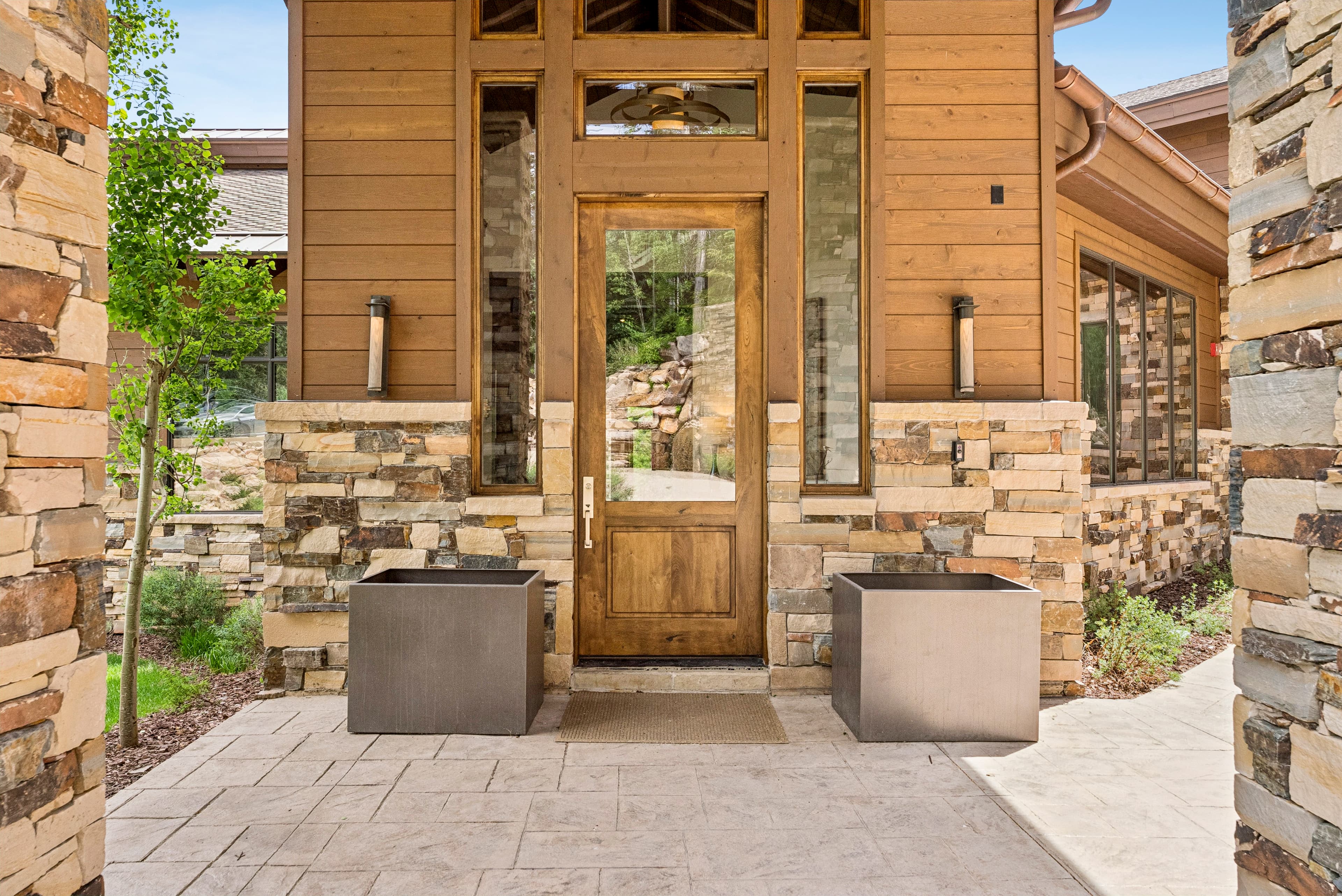 the front door of grandview, which is oversized and has a large window inlay