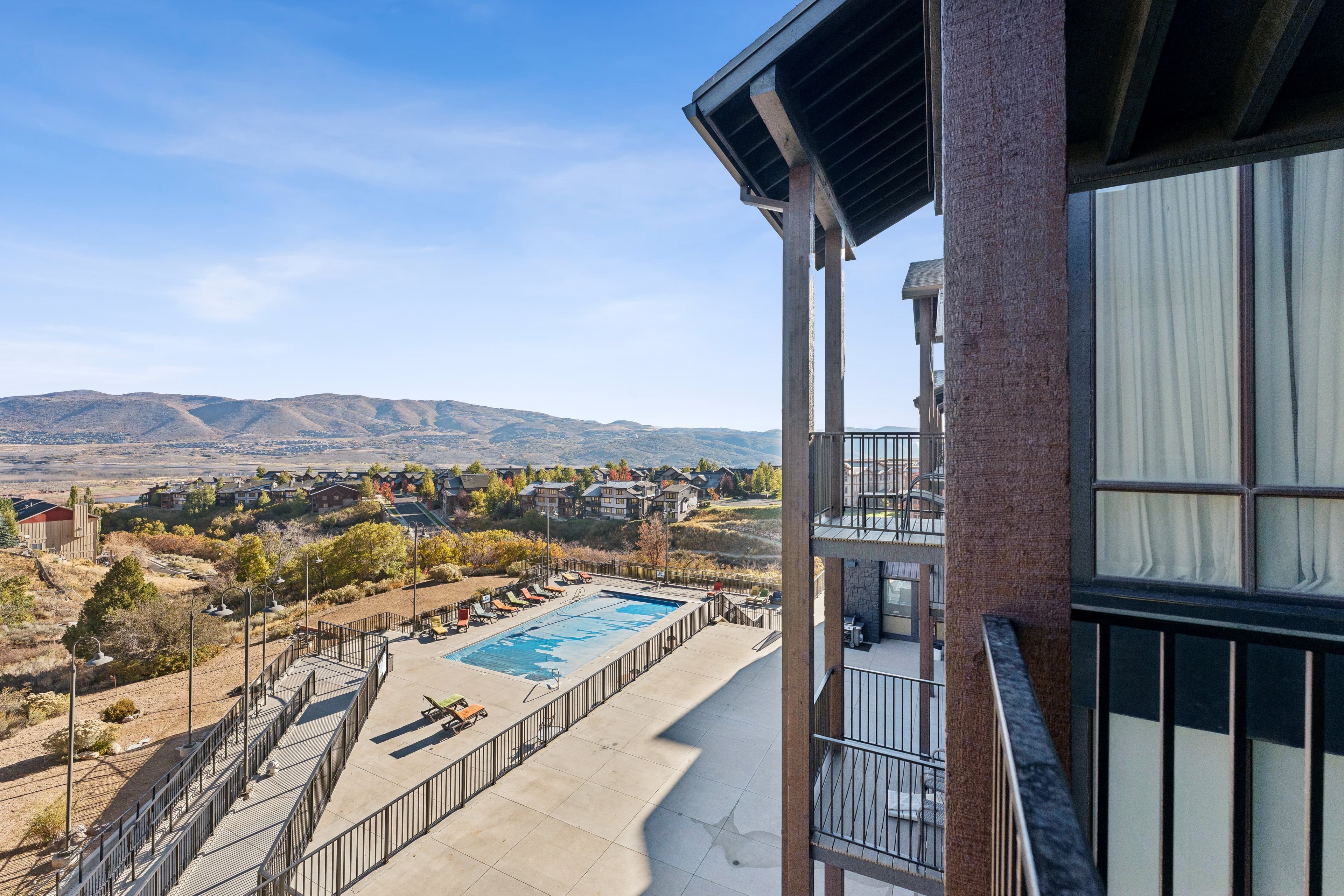 View from The Mason 3026 of heated pool and deck area and hot tub